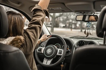IView of the nside of an Auto with woman driving