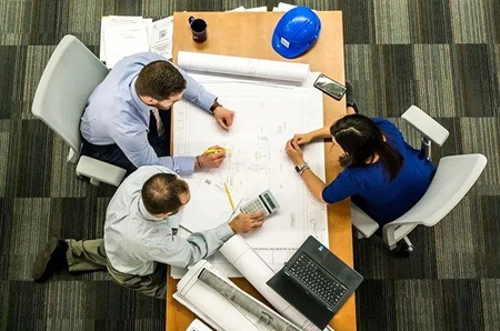 Top down photo of a business team working at atable